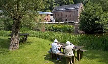 Tourists relaxing at the Dean Heritage Centre, Camp Mill, Soudley, Glos,
