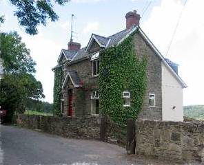 Spacious 3 storey cottage with a large garden, covered terrace and stunning views of the Forest of Dean.